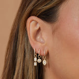 GOLD FRAME MARQUISE DIAMOND HUGGIE CHARM ON DIAMOND MINI HUGGIE EARRING